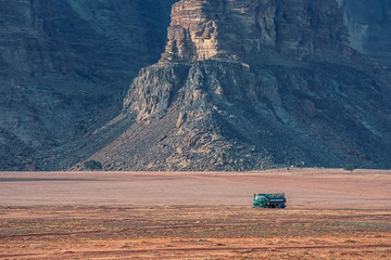 view on cargo track with water tank in incredible lunar landscape in Wadi Rum village in the...