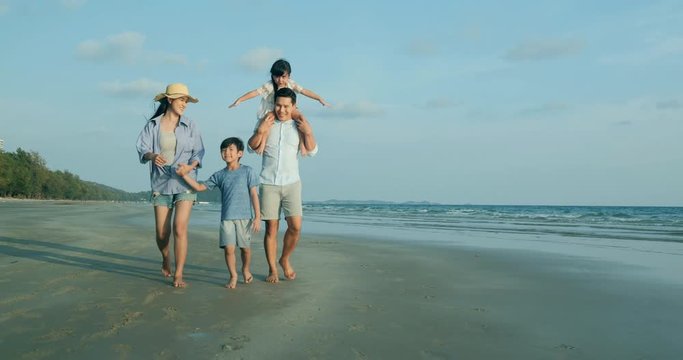SLOW MOTION, Asian family walking with happy emotion at beach together. Family, Holiday and Travel concept.