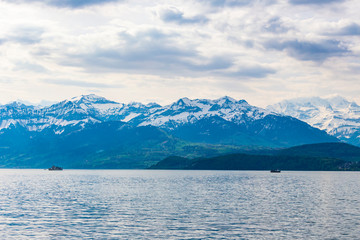 Obraz na płótnie Canvas Travel ship in lake Thun and view of Bernese Alps mountain Berne, Switzerland