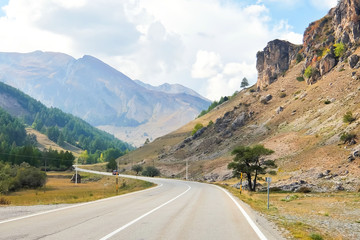 Fototapeta premium Colle della Maddalena (Piedmont, Italy), mountain landscape, winding road on italian-french border. Province of Cuneo, Italy.