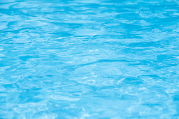 Fototapeta na wymiar Blue swimming pool rippled water detail