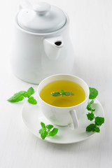 cup of herbal tea, white background