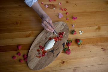 preparation of dessert with berries