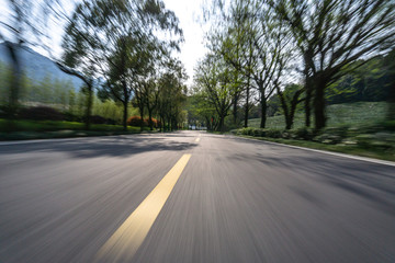 Fototapeta premium empty asphalt road with city skyline