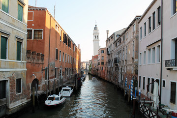 Fototapeta na wymiar Narrow water channel in Venice Italy