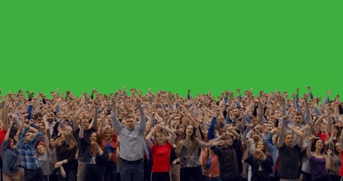 GREEN SCREEN CHROMA KEY Model released, front view of huge crowd jumping and cheering at a concert or a show. . Created with crowd replication techique. 4K UHD ProRes 4444