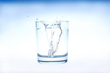 water splashing from glass isolated on white background