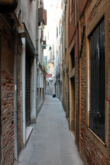 Narrow old street in Venice Italy