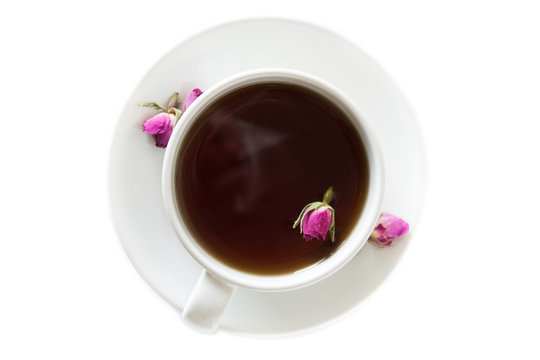 Cup of roses tea with rose