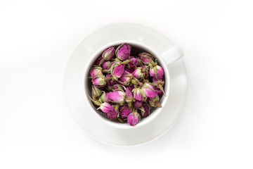 Cup of roses tea with rose