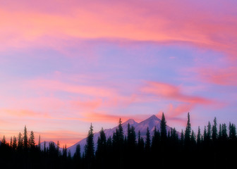 Sunset illuminates clouds over Goat Range, Banff National Park, Canada