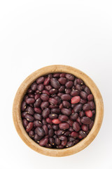 red beans in a wooden plate on a white background