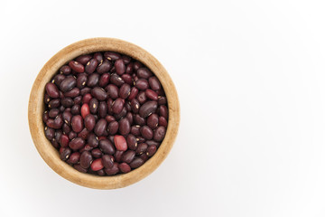 red beans in a wooden plate on a white background