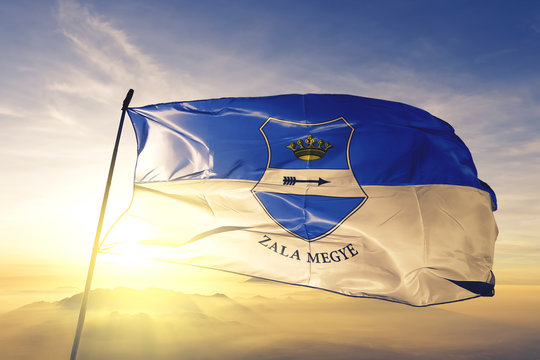 Zala county of Hungary flag waving on the top sunrise mist fog