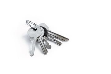 Several keys on a white isolated background,the keys to the apartment.