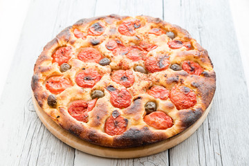 Focaccia typical of Bari Italy with tomatoes and olive