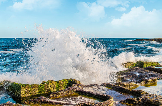 Sea waves and coastal stones seascape as background - Powered by Adobe