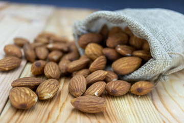 almonds and nuts on wooden table