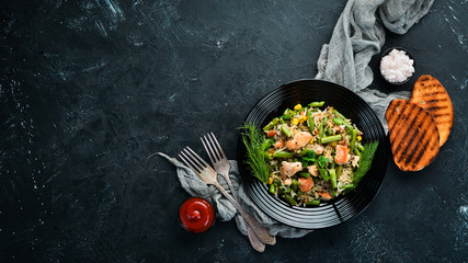 Risotto with chicken fillet and vegetables. Rice. Top view. Free copy space.