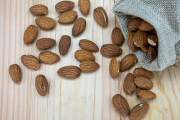 almonds and nuts on wooden table