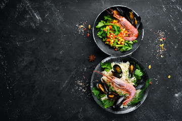 Rice and seafood. Top view. Free copy space.