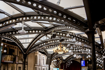 Lviv, Ukraine - September 30, 2016: Iron curved roof beams in a cafe