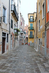 Fototapeta na wymiar Narrow old street in Venice Italy