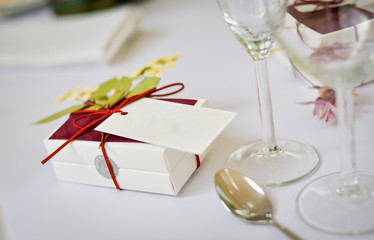 gift box with ribbon on dining table with blank space for text