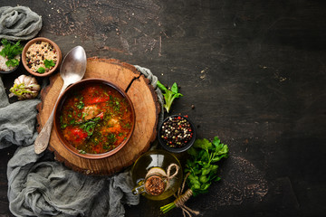 Harcho soup with meat and tomatoes. Ukrainian cuisine. Top view. Free space for your text. Rustic style.