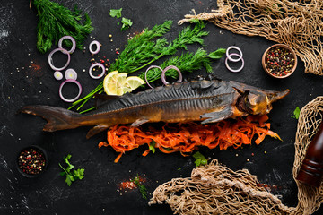 Baked Fish Sturgeon with Vegetables. Top view. Free space for your text. Rustic style.