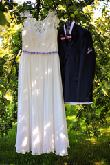 bride and groom wedding dress and suit
