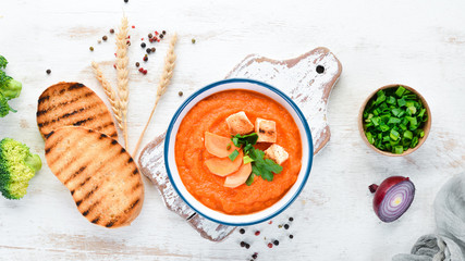 Carrot puree soup. with toast bread. Dietary food. Top view. Free copy space.