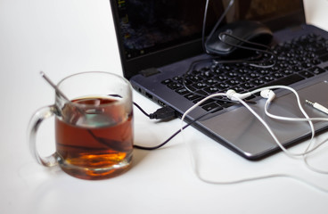 a cup of tea and a laptop