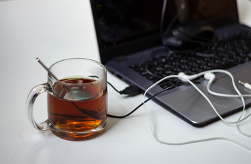 a cup of tea and a laptop