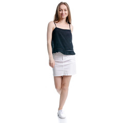 Fototapeta premium Woman in white skirt and black goes walking on white background isolation