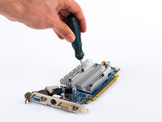 .man repairing graphics card