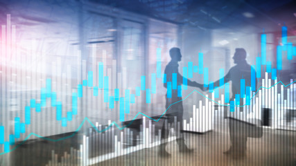 Stock trading candlestick chart and diagrams on blurred office center background.