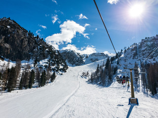 Chairlift "Vitelli", going to the top of the "Canalone Franchetti" slope on mount Faloria in Cortina d'Ampezzo, Dolomites, Italy.