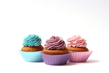  tasty cupcakes on a white background.