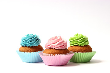  tasty cupcakes on a white background.