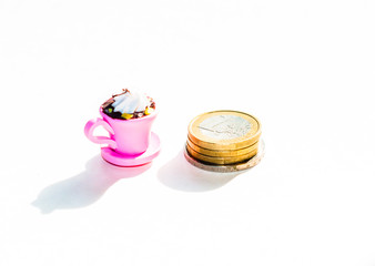 A cup of coffee and money