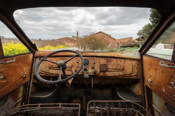 Old and rusty car from inside