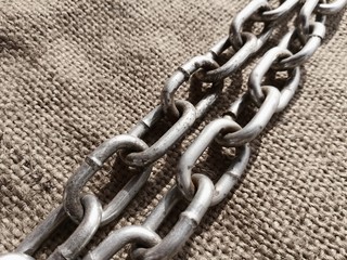A chain is a serial assembly of connected pieces, called links, typically made of metal, with an overall character similar to that of a rope in that it is flexible and curved in compression but linear