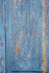 Texture of old rusty wood, painted blue with spots of first yellow layer.