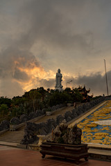 Fototapeta na wymiar Ho quoc pagoda in phu Quoc island. Monument of Lady buddha in a beautiful sunset in Vietnam