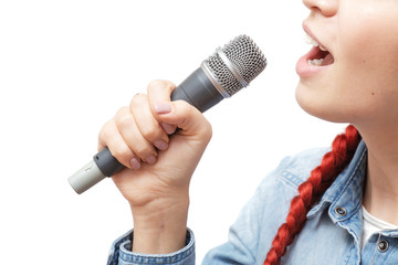 Asian woman singing a song with microphone isolated on white background