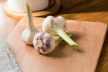 Fresh young garlic on a cutting board