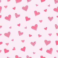 Seamless pattern with hearts on a soft pink background. Vector design.