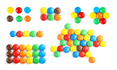 Set of tasty colorful candies on white background