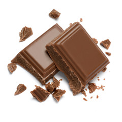 Milk organic chocolate pieces isolated on white background